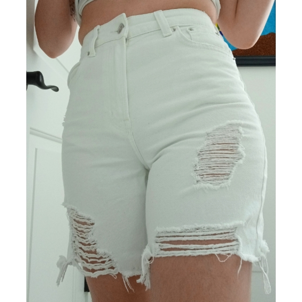 Distressed white denim shorts